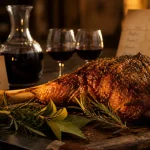 Accord mets vins agneau : gigot rôti aux herbes, vin rouge et verres